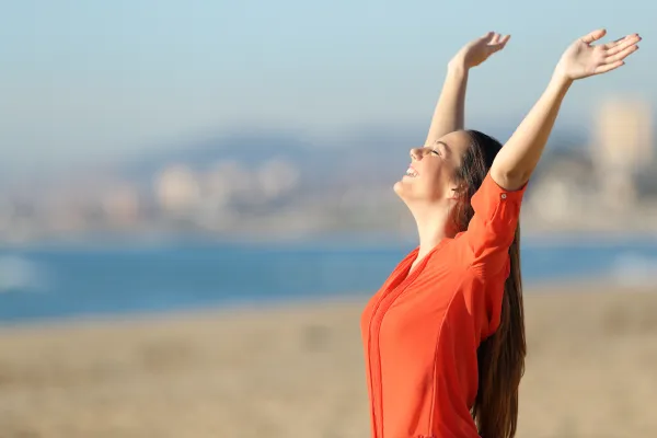 lady with arms up enjoying the air photo